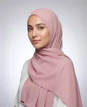 Crafted from luxurious crepe pink crepe georgette Hijab with a delicate texture, ABAQY Georgette Crepe Hijabs offer lightweight comfort. Available in over 12 shades, they cater to various wardrobe preferences and styles, perfect for both daytime and evening wear.