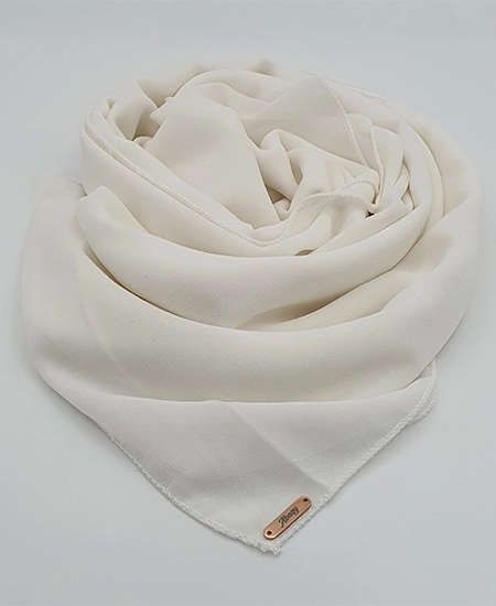 Introducing our Ivory Crepe Chiffon Hijab, crafted from smooth, soft, and non-transparent fabric. This lightweight hijab offers an elegant drape for a sophisticated look, perfect for those who value both comfort and style.