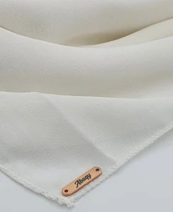 Introducing our Ivory Crepe Chiffon Hijab, crafted from smooth, soft, and non-transparent fabric. This lightweight hijab offers an elegant drape for a sophisticated look, perfect for those who value both comfort and style.