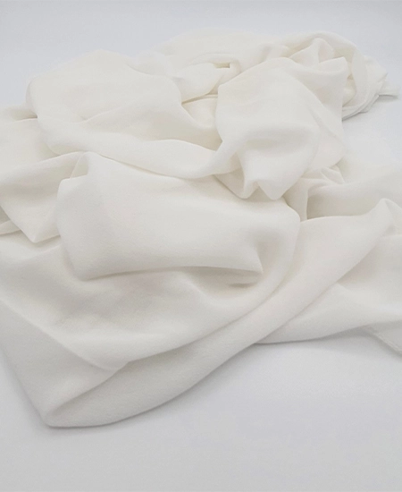 Introducing our Ivory Crepe Chiffon Hijab, crafted from smooth, soft, and non-transparent fabric. This lightweight hijab offers an elegant drape for a sophisticated look, perfect for those who value both comfort and style.