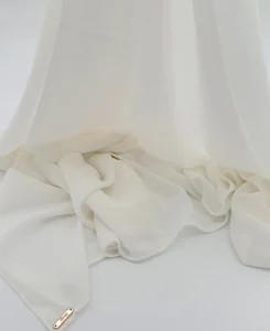 Introducing our Ivory Crepe Chiffon Hijab, crafted from smooth, soft, and non-transparent fabric. This lightweight hijab offers an elegant drape for a sophisticated look, perfect for those who value both comfort and style.