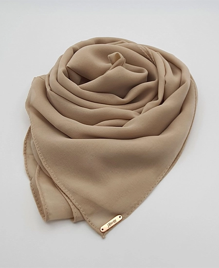 Introducing our Premium Light French Beige Chiffon Hijab, crafted from smooth, soft, and non-transparent fabric. This lightweight hijab offers an elegant drape for a sophisticated look, perfect for those who value both comfort and style.
