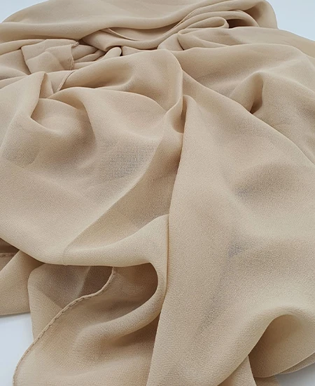 Introducing our Premium Light French Beige Chiffon Hijab, crafted from smooth, soft, and non-transparent fabric. This lightweight hijab offers an elegant drape for a sophisticated look, perfect for those who value both comfort and style.