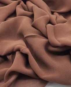 Introducing our Premium Umber Brown Chiffon Hijab, crafted from smooth, soft, and non-transparent fabric. This lightweight hijab offers an elegant drape for a sophisticated look, perfect for those who value both comfort and style.