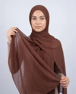 Introducing our Premium Umber Brown Chiffon Hijab, crafted from smooth, soft, and non-transparent fabric. This lightweight hijab offers an elegant drape for a sophisticated look, perfect for those who value both comfort and style.