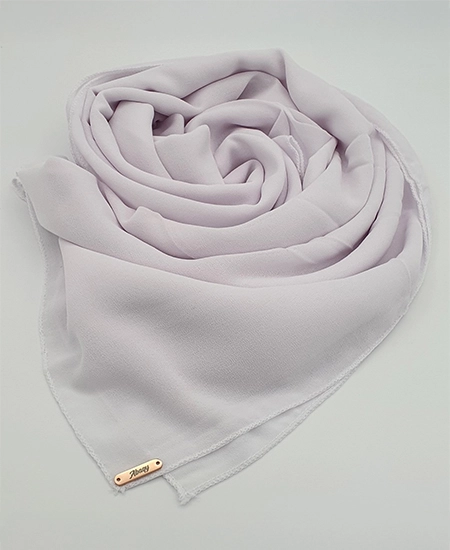 Introducing our White Crepe Chiffon Hijab, crafted from smooth, soft, and non-transparent fabric. This lightweight hijab offers an elegant drape for a sophisticated look, perfect for those who value both comfort and style.